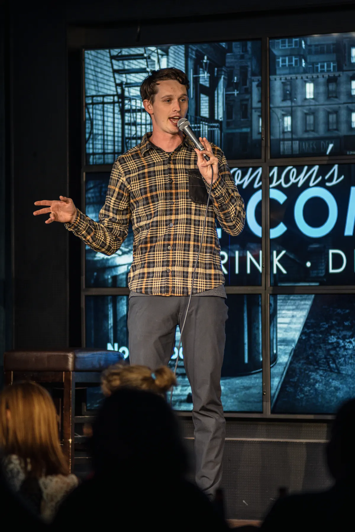 Comedian on stage with microphone