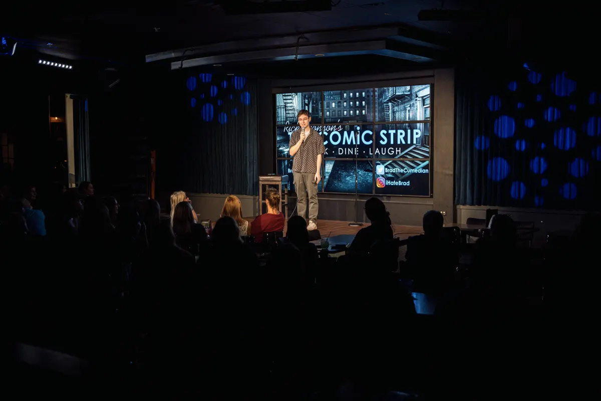 Comedian performing at The Comic Strip