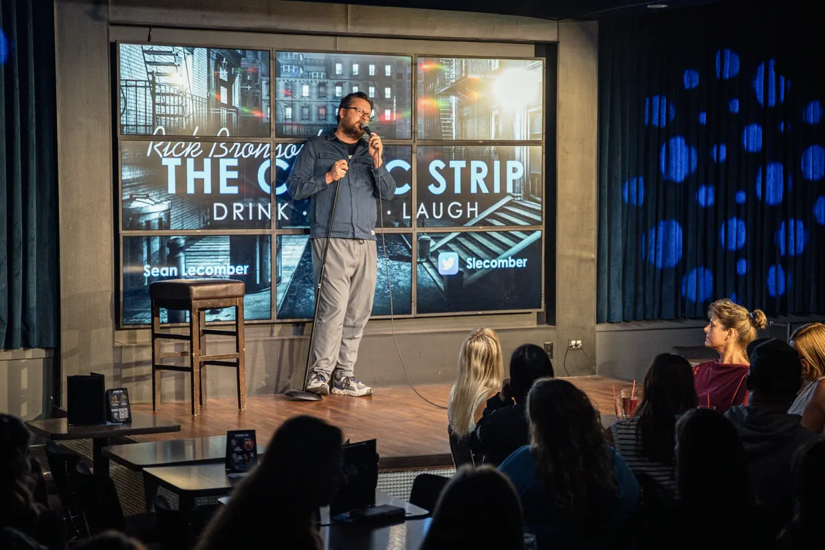Sean Lecomber with Comic Strip sign